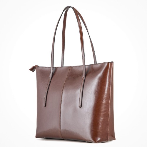 brązowa torba skórzana typu shopper, duża i pojemna, zamykana na suwak.