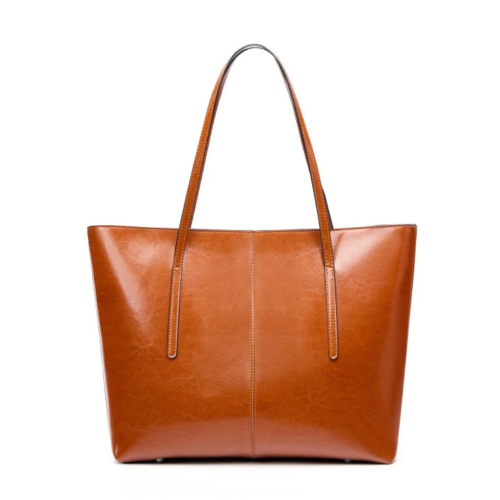 Duża skórzana torba typu shopper w kolorze karmelowym z uchwytem na ramię i pojemnym wnętrzem.